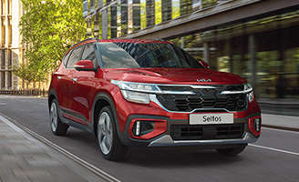 2023 Kia EV6 Accelerating On A Narrow Road Front View